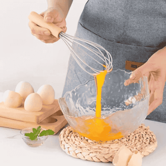 Juego de 12 utensilios de cocina de silicona con mangos de madera, antiadherentes y resistentes al calor.